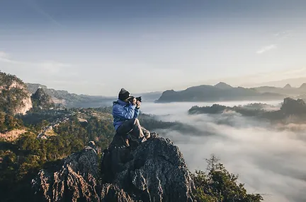 photographer on a clifftop